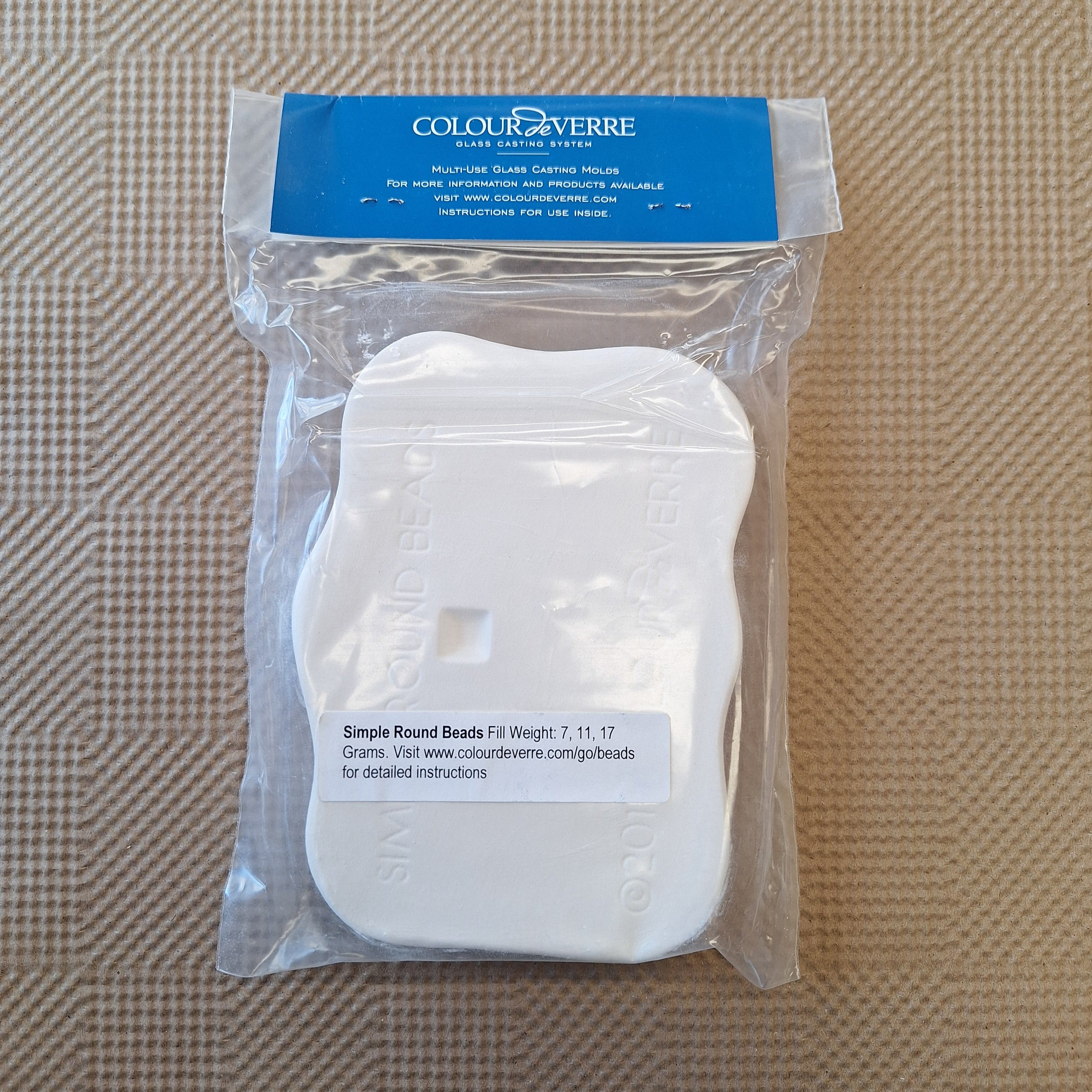 Packaged glass casting mold with 'Colour de Verre' branding on a textured brown background