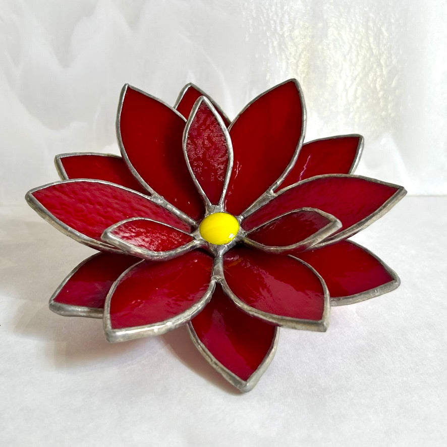 Stained glass poinsettia on a white background.